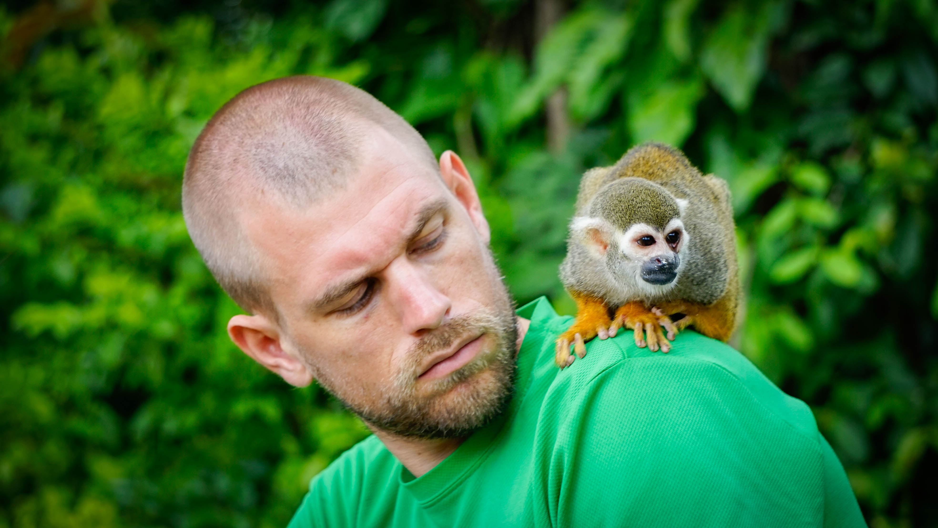 A man with a monkey on the shoulder